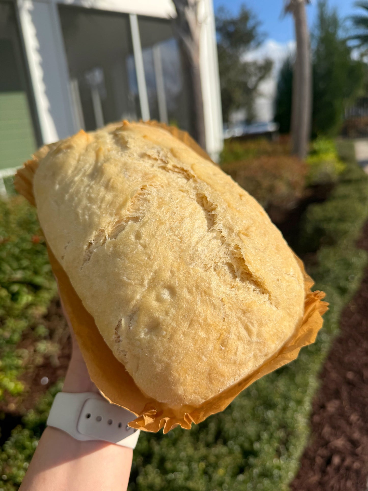 Handmade signature artisan bread loaf with golden crust and open airy crumb from Crushin on Cookies Plant City Florida