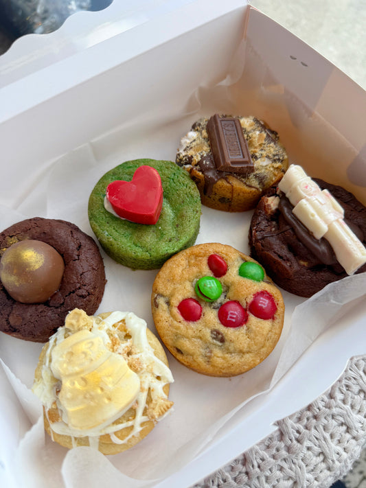 Assorted cookies with different toppings in a box