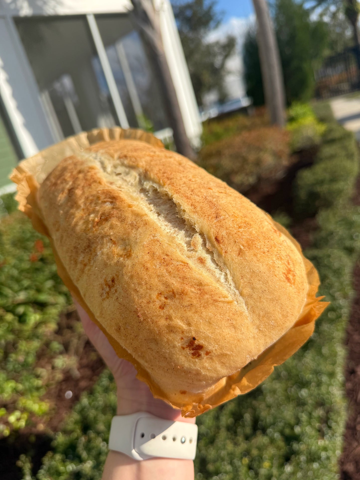 Handmade cinnamon raisin swirl artisan bread loaf with visible cinnamon ribbon through the crumb from Crushin on Cookies Plant City Florida