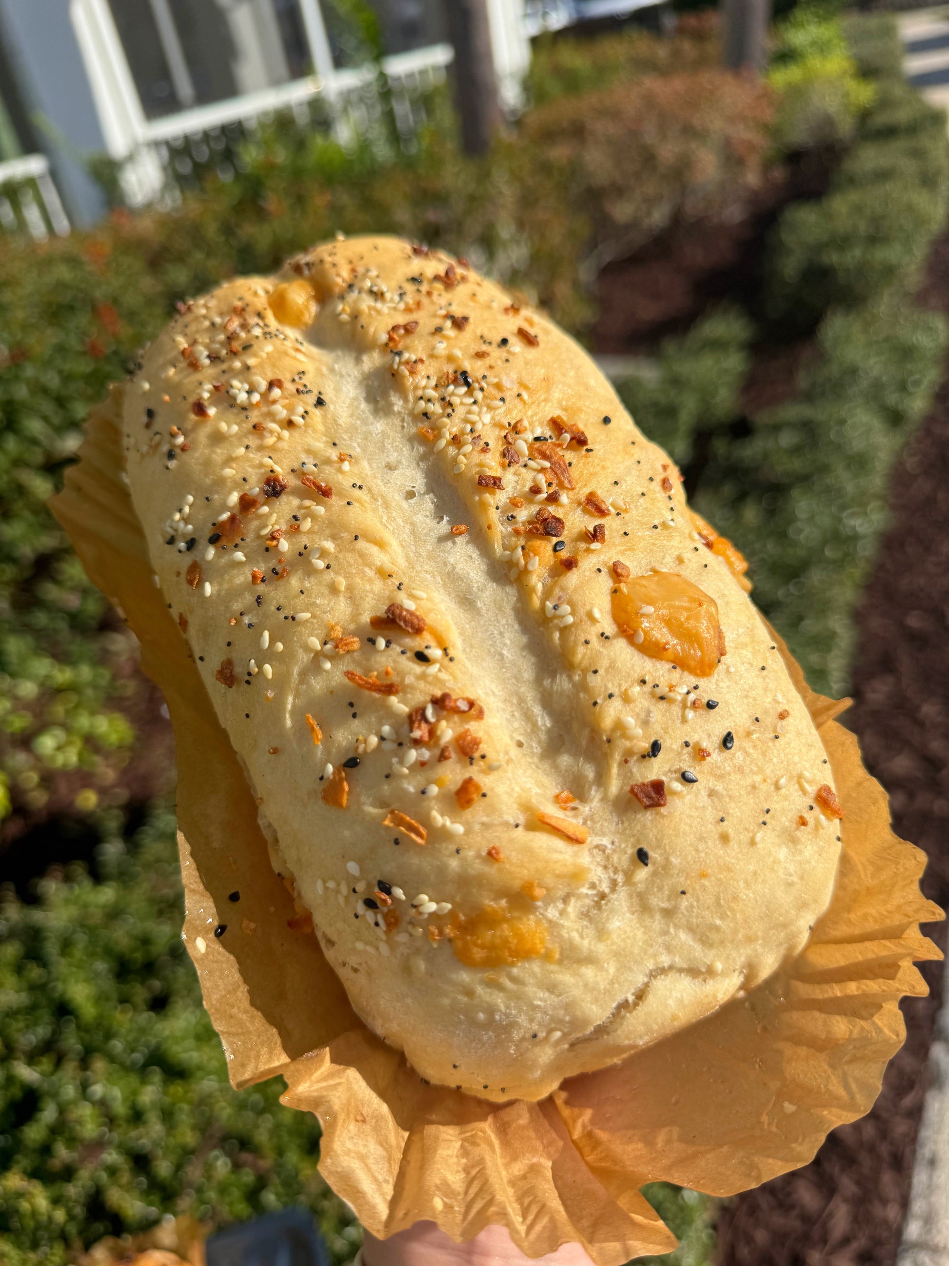 Handmade everything bagel parmesan artisan bread loaf with sesame seeds and cheese crust from Crushin on Cookies Plant City Florida